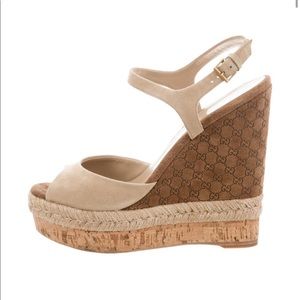 Gucci wedges with the GG insignia on wedge.